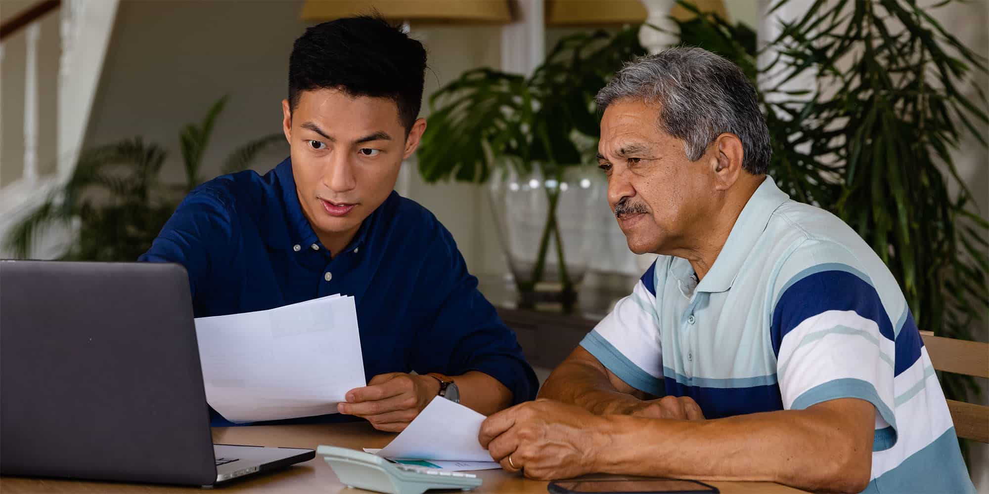 son helping senior parent with finance