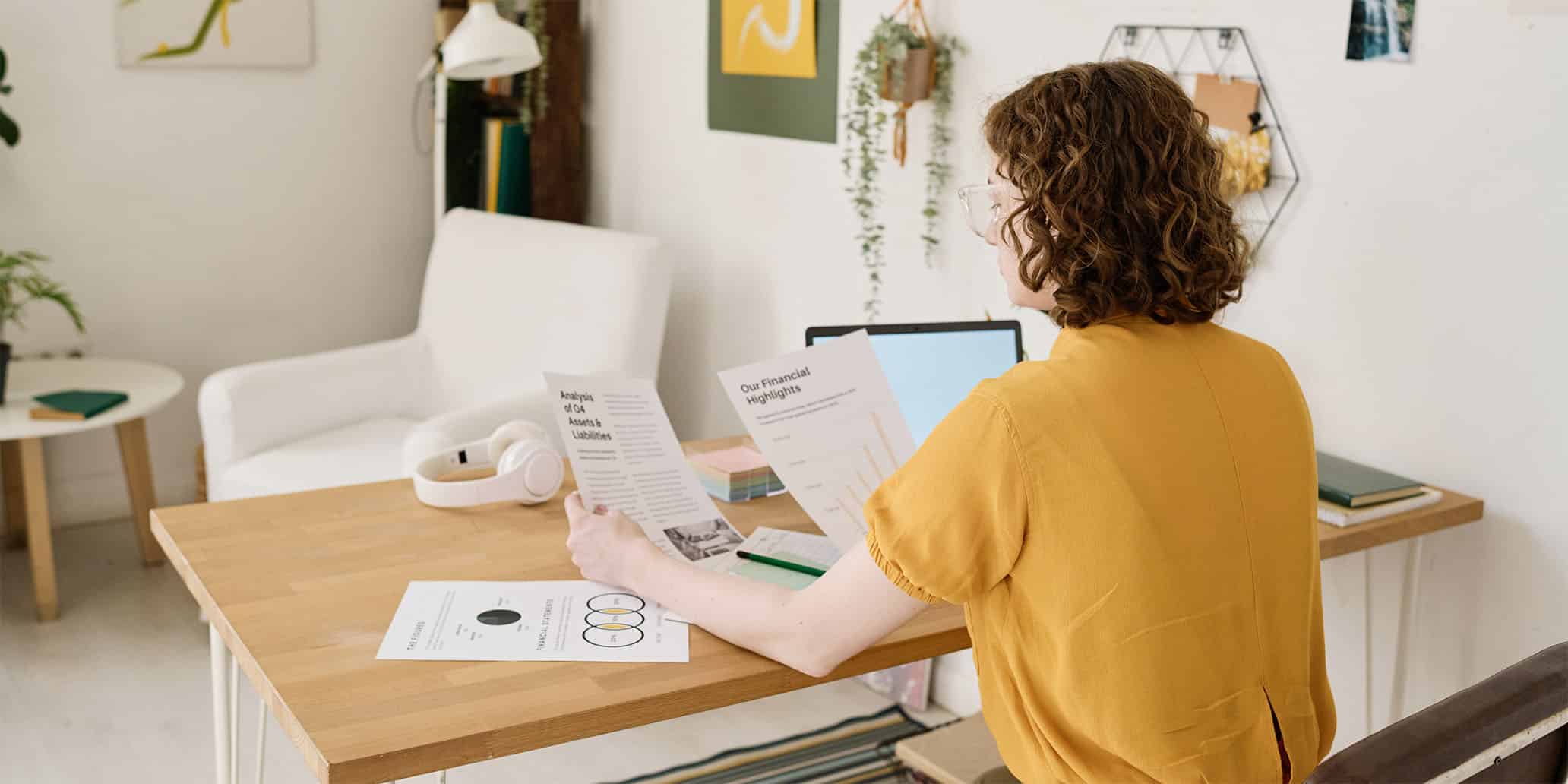 woman reading etf and mutual fund fact sheet