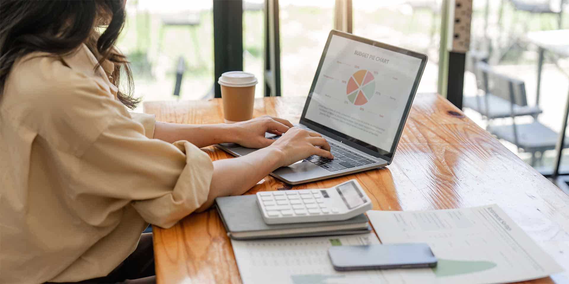 young lady working on investment portfolio at home